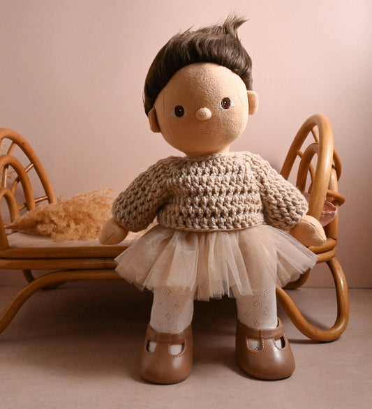 A dreamy little outfit with the perfect blend of comfort and charm.

This set features a hand-crocheted chunky knit sweater in a soft natural tone — warm and textured, yet light enough for year-round play. Paired with a floaty cream tulle skirt layered over delicate tights, it brings a gentle, ballerina-inspired elegance to your doll's wardrobe.

Perfect for storytelling, dressing up, or quiet moments of pretend-play.