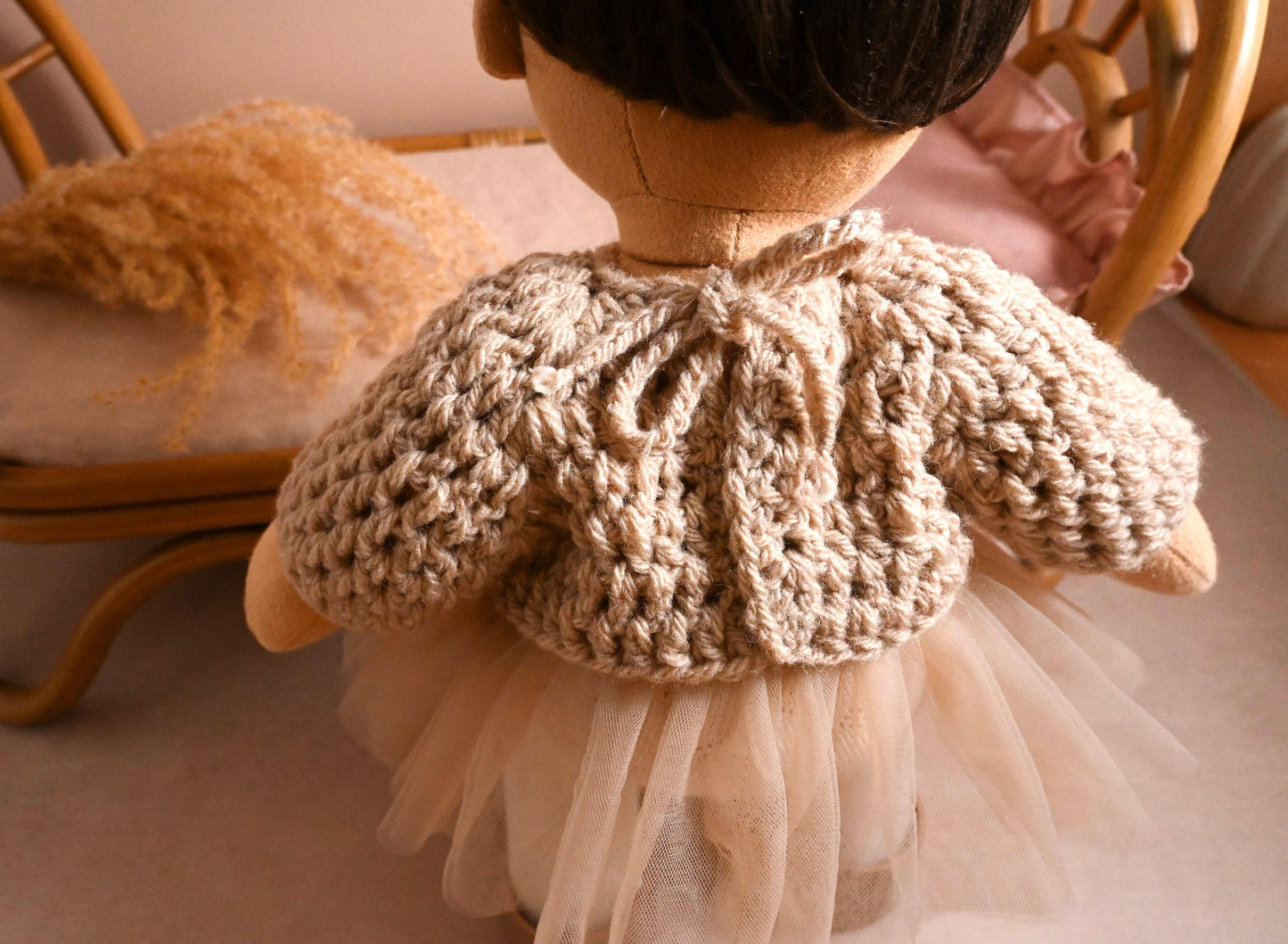 A dreamy little outfit with the perfect blend of comfort and charm.

This set features a hand-crocheted chunky knit sweater in a soft natural tone — warm and textured, yet light enough for year-round play. Paired with a floaty cream tulle skirt layered over delicate tights, it brings a gentle, ballerina-inspired elegance to your doll's wardrobe.

Perfect for storytelling, dressing up, or quiet moments of pretend-play.